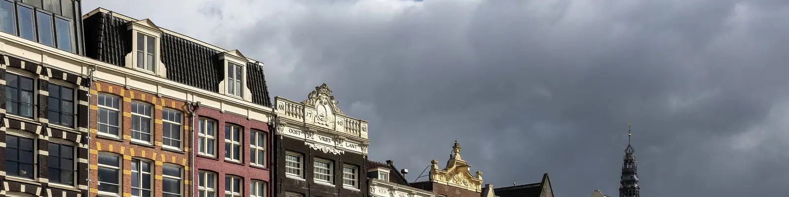 Canal houses on the Damrak, Amsterdam, Netherlands